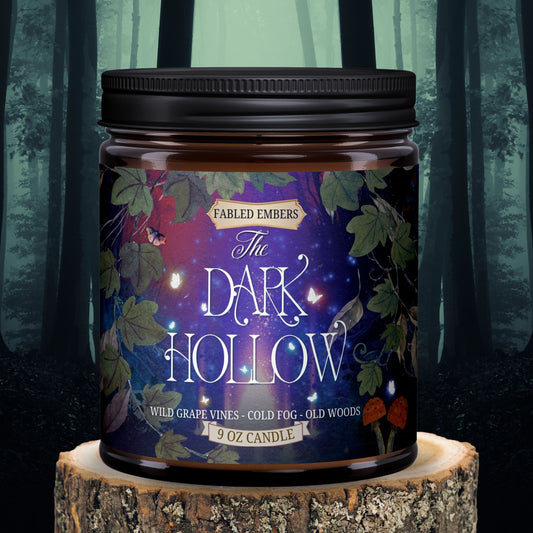 The Dark Hollow dark cozy cottagecore candle smells like grape vines and woods 9 oz amber glass jar